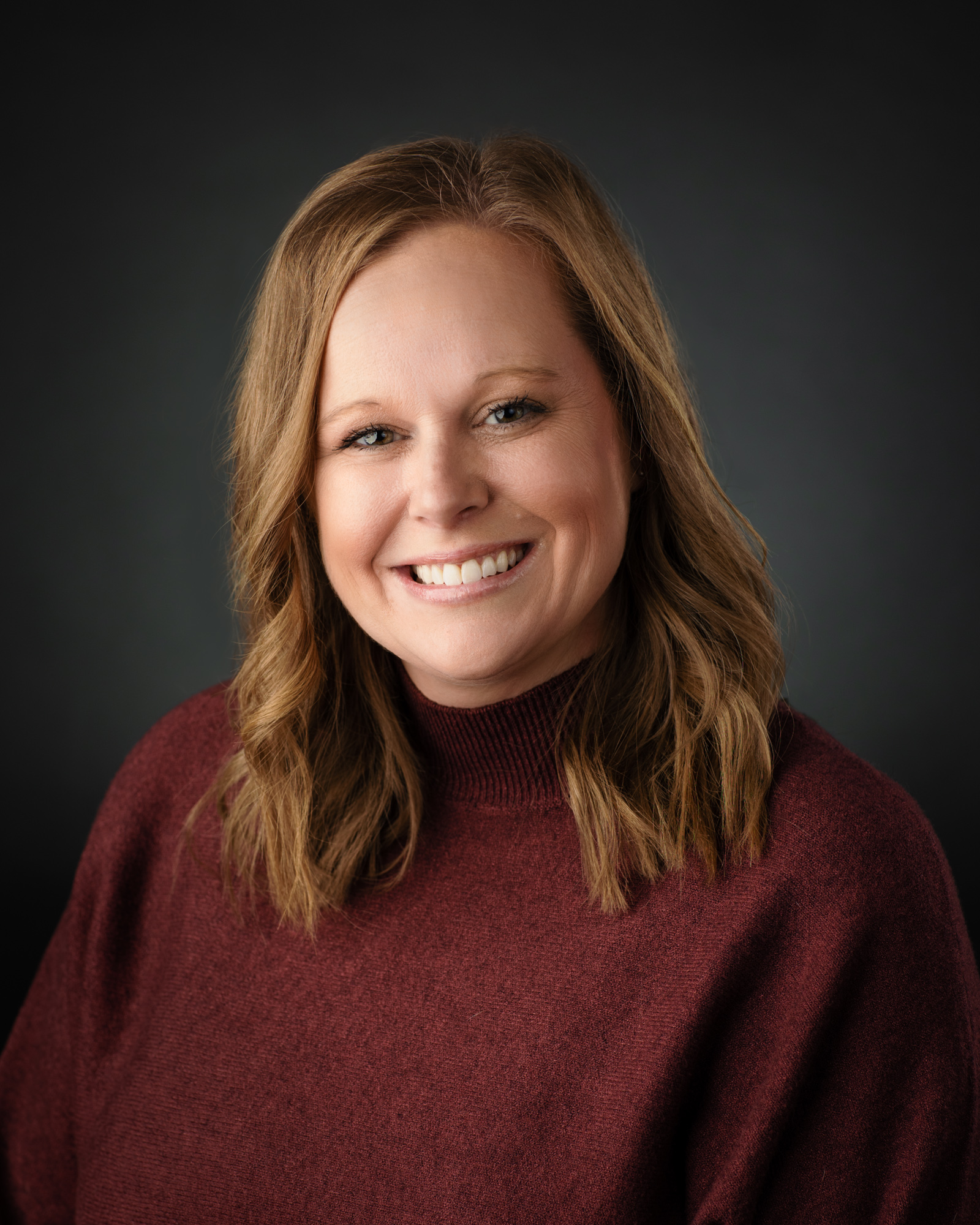 A headshot photograph of Courtnie Trone, a member of the laboratory services team