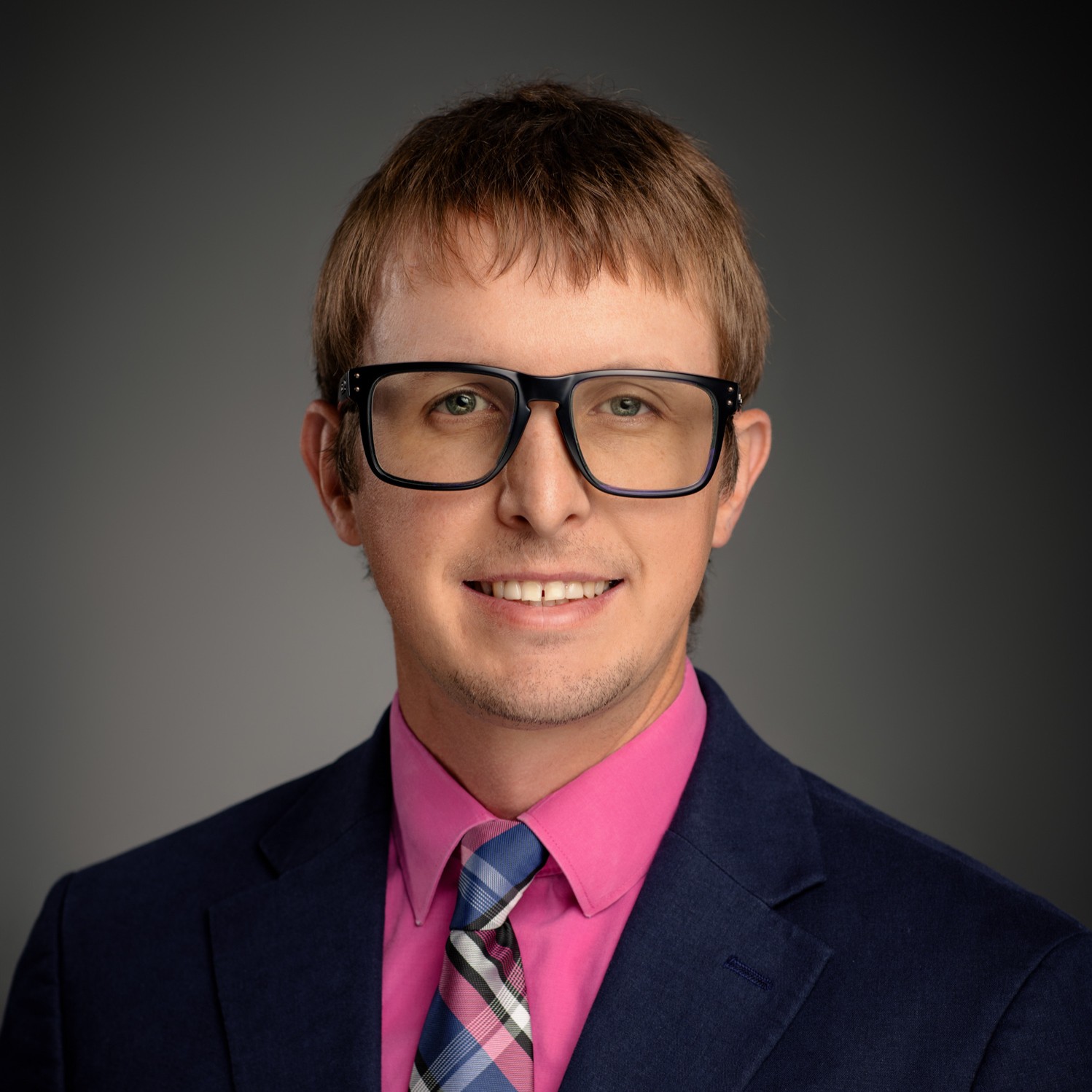 Photo of a blonde man in glasses who is the director of environmental services.